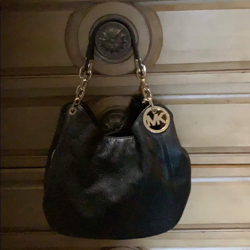 Michael Kors purse with storage bag.